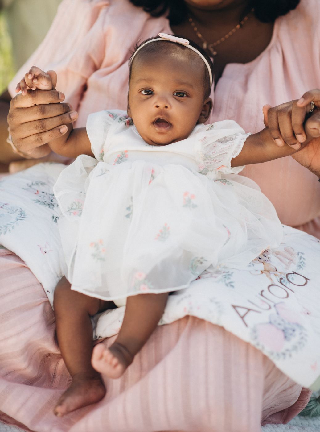 Portrait of Aurora in a lace christening gown